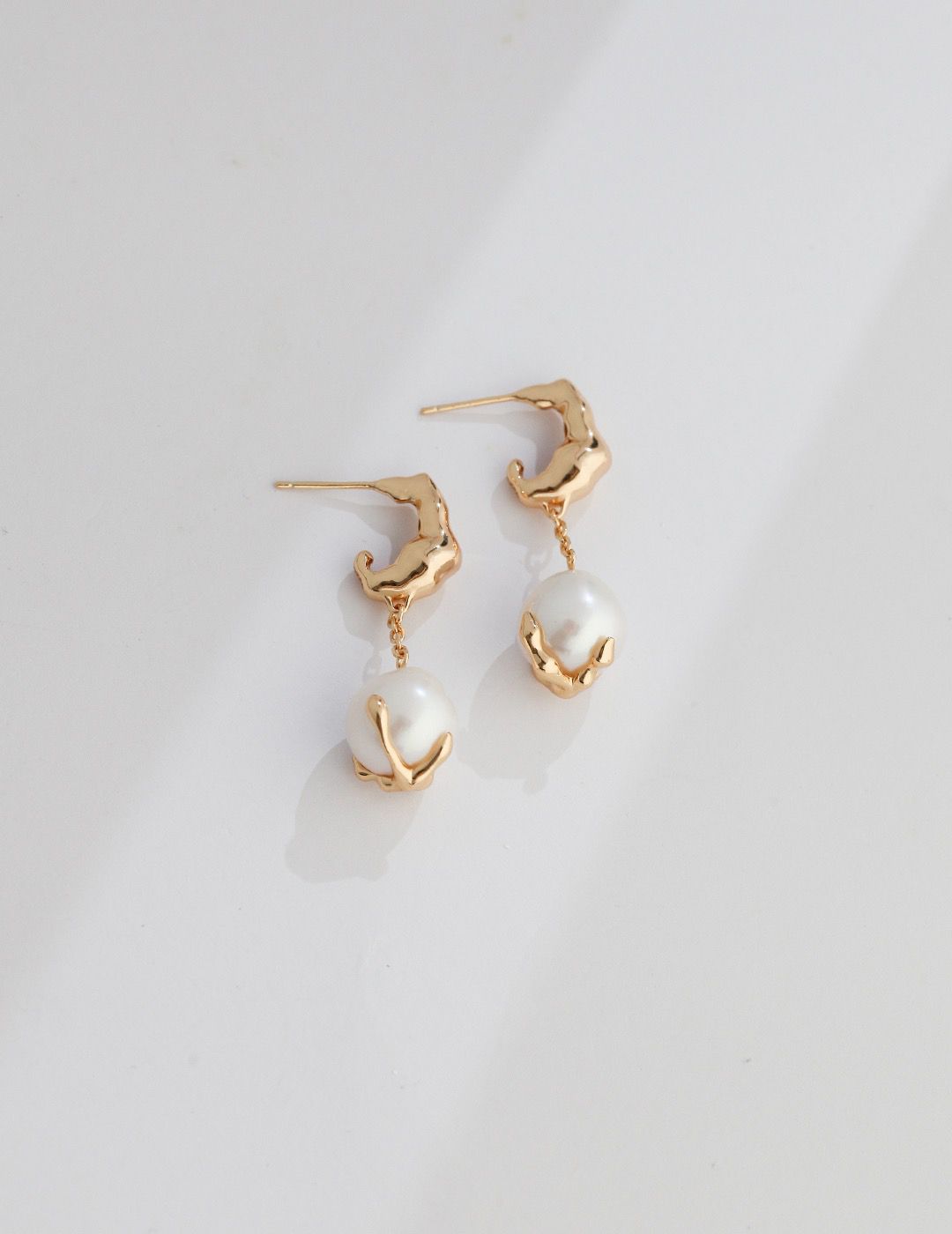 Timeless Pearl Drops" exquisite pearl earrings with lustrous pearls that sway gently. Perfect for any occasion.