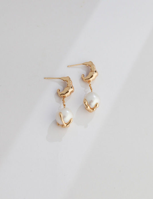 Timeless Pearl Drops" exquisite pearl earrings with lustrous pearls that sway gently. Perfect for any occasion.